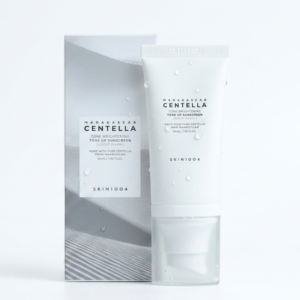 واقي الشمس SKIN1004 مدغشقر سنتيلا لتفتيح لون البشرة - SPF50+ PA++++ | لون خوخي مع نياسيناميد وحمض الترانيكساميك | 50 مل | كوزمتك نجم صلاله
